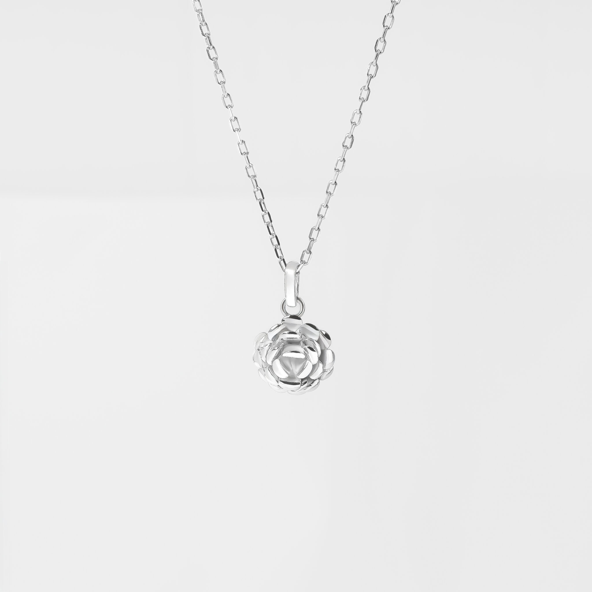 SCULPTURAL SILVER ROSE PENDANT
